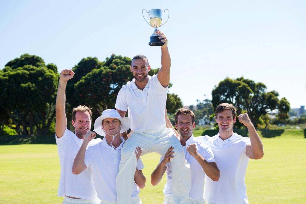 happy-cricket-team-with-throphy-standing-on-field-2025-04-05-03-47-56-utc.jpg