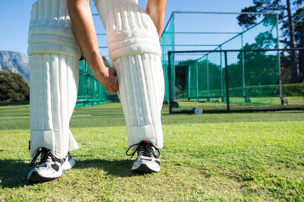 low-section-of-cricket-player-tying-kneedpads-2025-04-03-06-15-53-utc.jpg